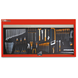 Wall-mounted tool organizer with various tools on a white background