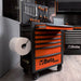 Orange tool cart with tools and equipment in a workshop setting, featuring the Beta brand.