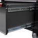 Close-up of a black cabinet with a visible hinge and metal components.