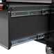 Close-up of a black cabinet with a visible hinge and metal components.