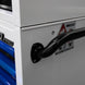 Close-up of a white toolbox with a black handle and visible brand logo.
