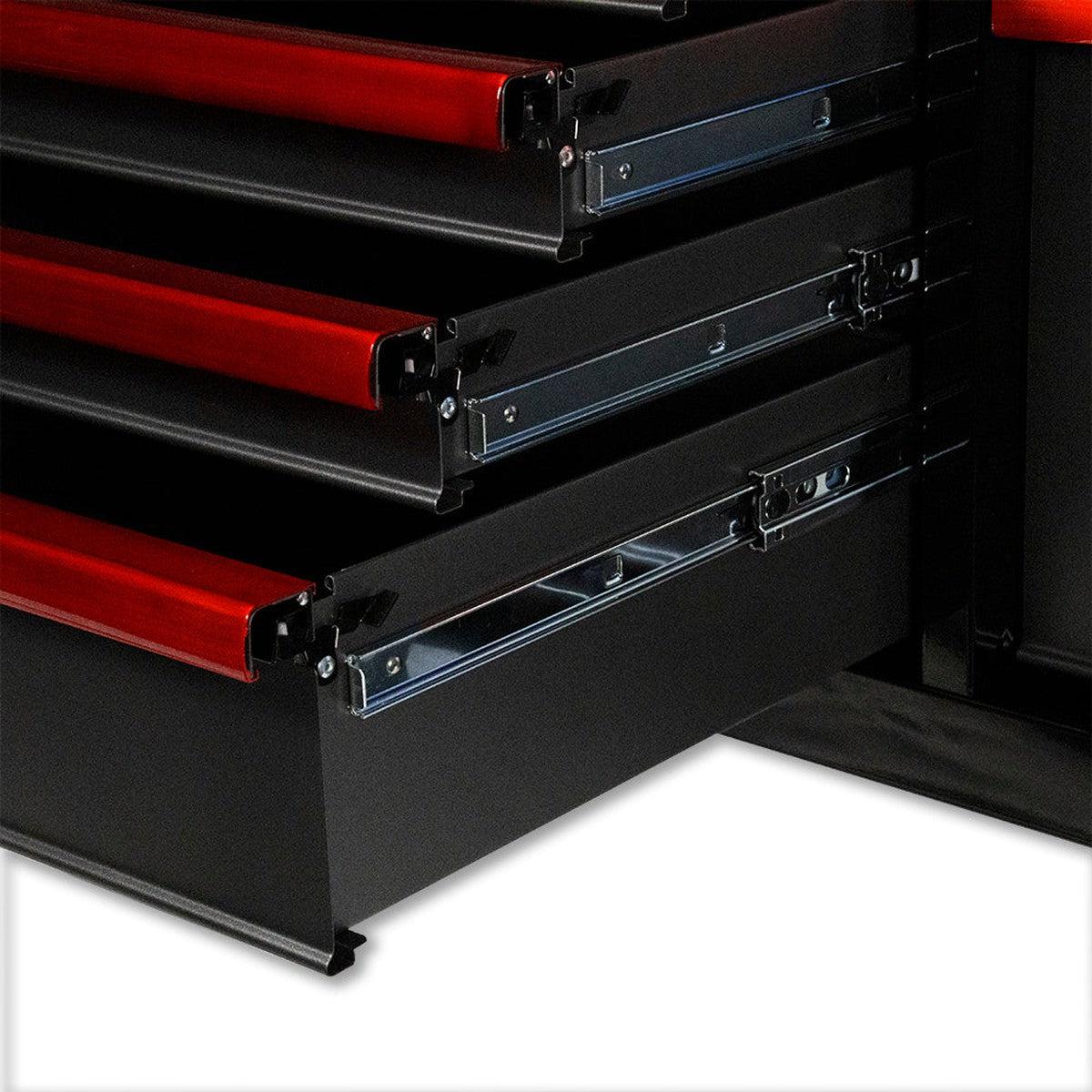 Close-up of a black and red tool chest with open drawers on a white background