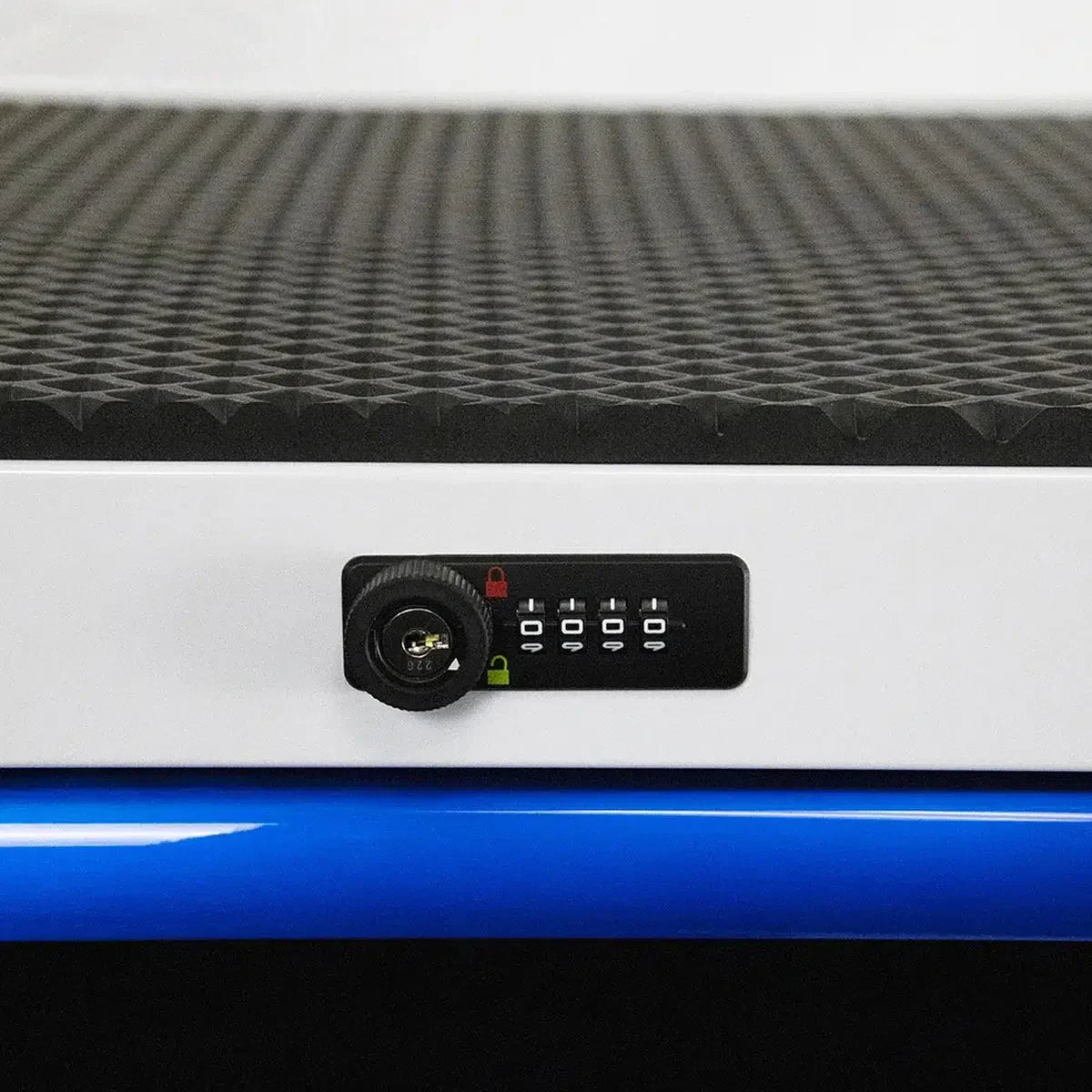 Close-up of a control panel with buttons and a power socket on a textured surface.