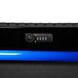 Close-up of a black cabinet device with a blue trim on a white background