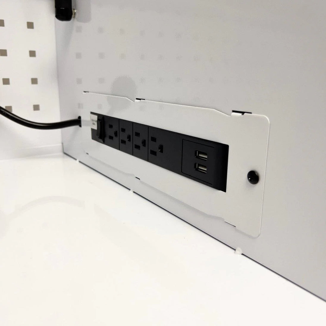 Power strip with multiple outlets and USB ports on a white surface.