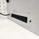Power strip with multiple outlets and USB ports on a white surface.