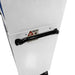 Close-up of a white appliance with a black handle and safety label on a white background