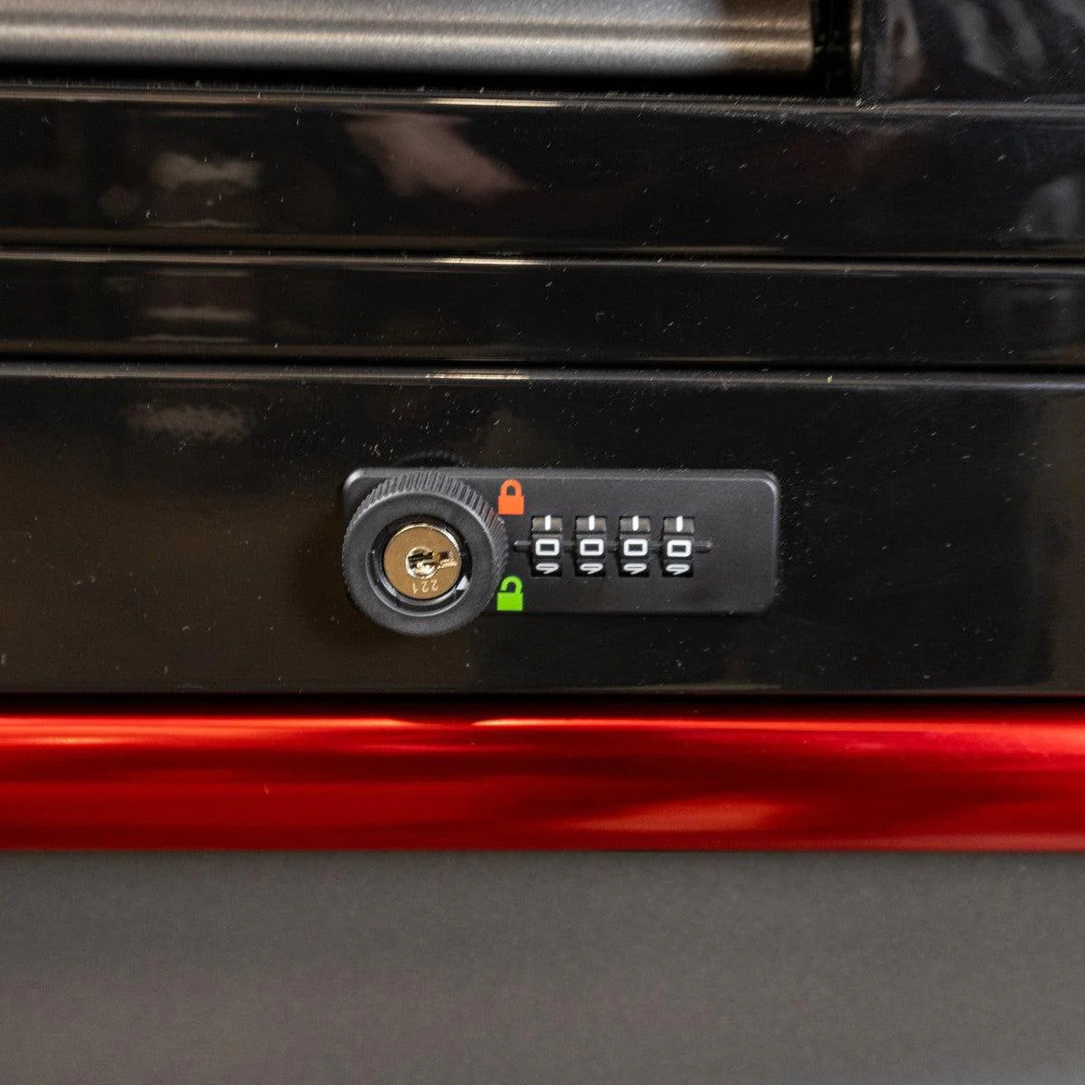 Black cabinet with a combination lock on a red background