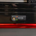 Black cabinet with a combination lock on a red background