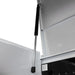 Close-up of a white cabinet with a black support rod on a white background