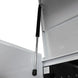 Close-up of a white cabinet with a black support rod on a white background