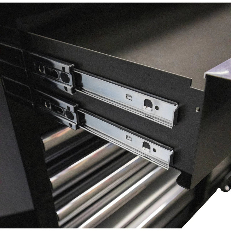Close-up of a black tool chest with metal drawers.