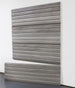 slatwall panel on a white wall