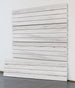 Wooden slat wall panel on a white background