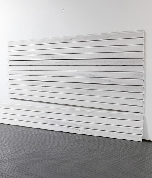 White wooden slatwall panel against a white wall