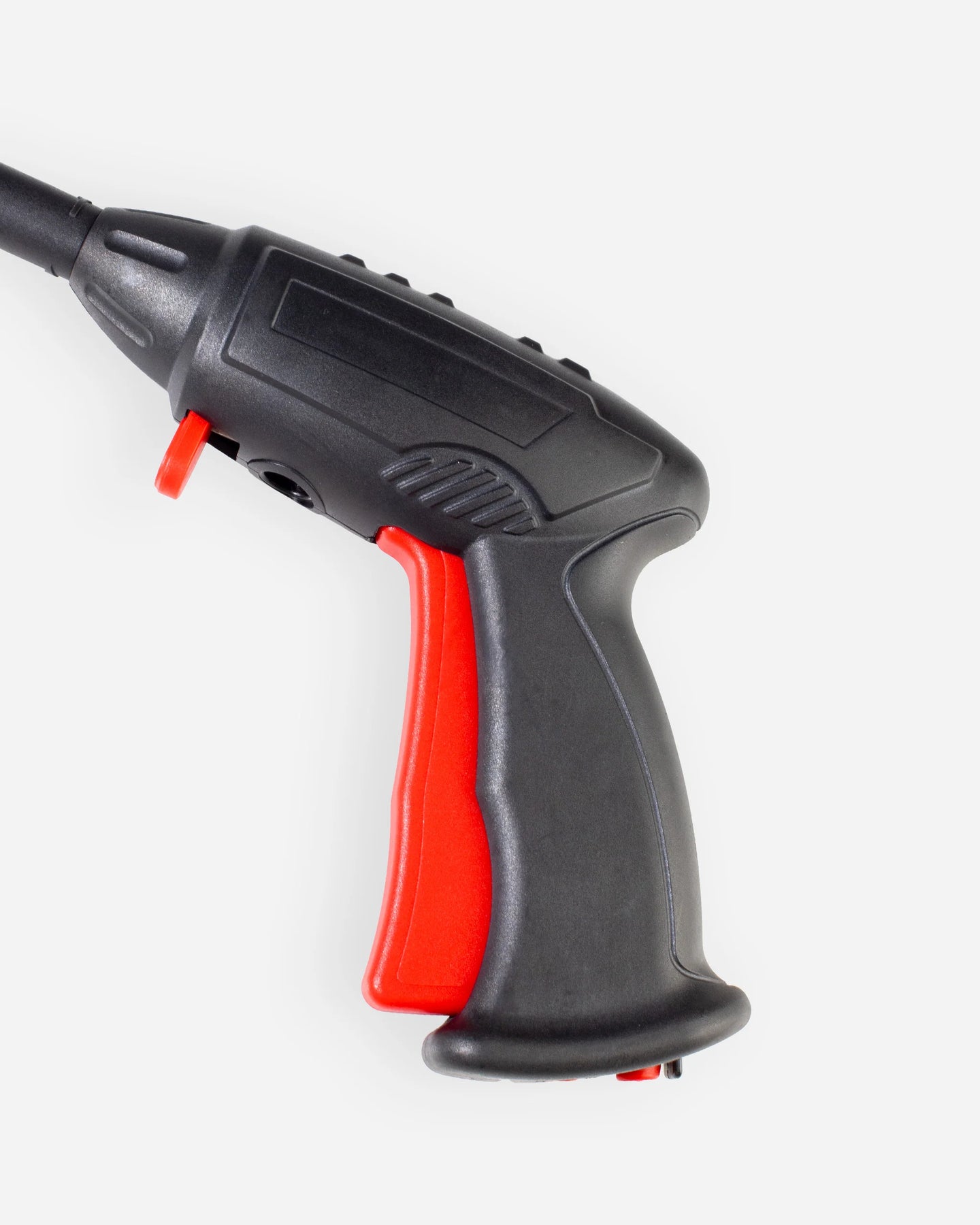 A close-up of a handheld power tool with a black body and a bright red trigger grip, shown against a plain light gray background.