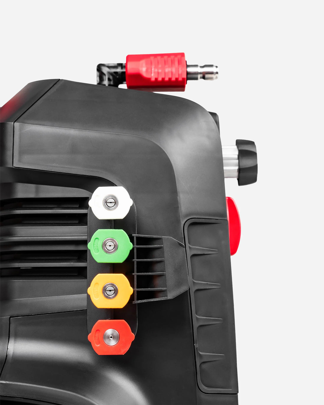 Close-up of a black pressure washer hose connector with a red plug, alongside four colored port caps in white, green, yellow, and red on a light gray background.